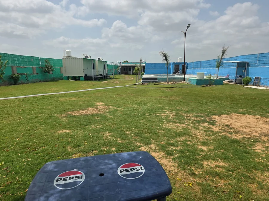 Green lawn at Clyrova Farmhouse near Jaipur
