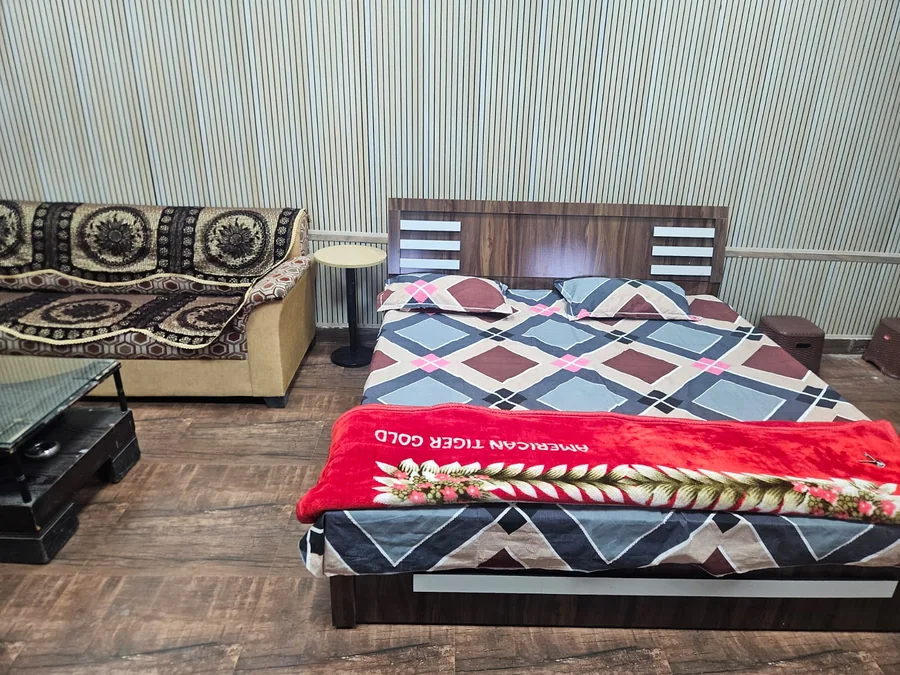 Premium family room at Clyrova Farmhouse with bed and sofa
