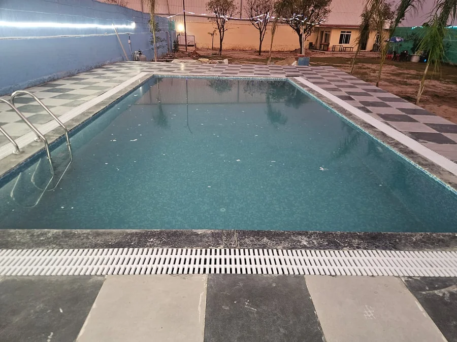 Swimming pool and poolside view at Clyrova Farmhouse