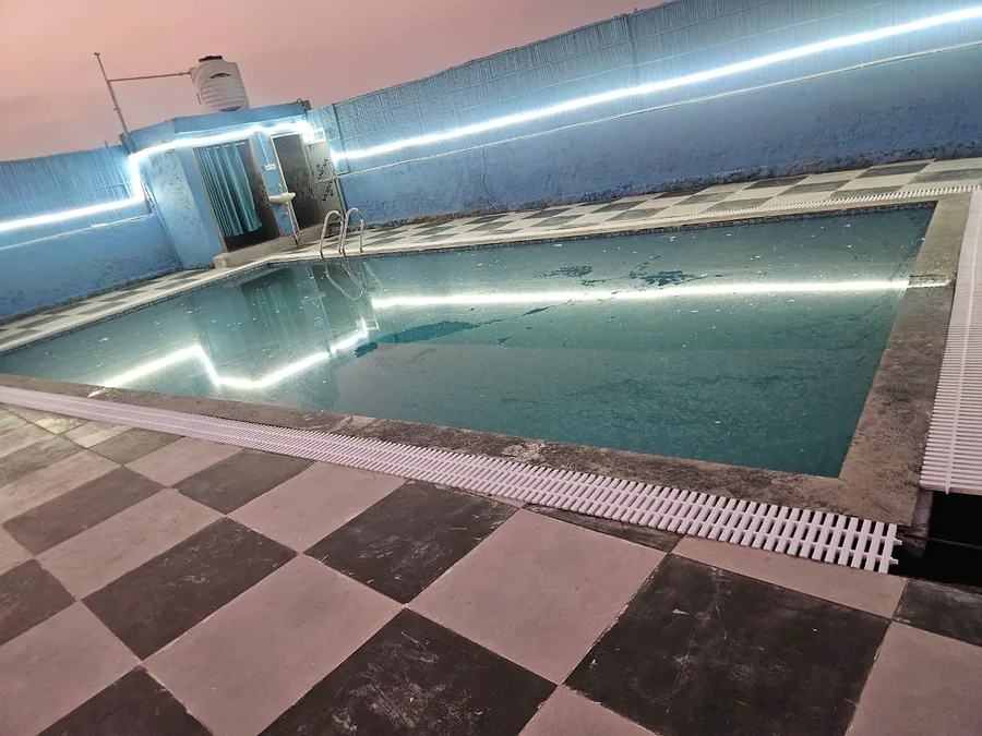 Swimming pool and poolside view at Clyrova Farmhouse